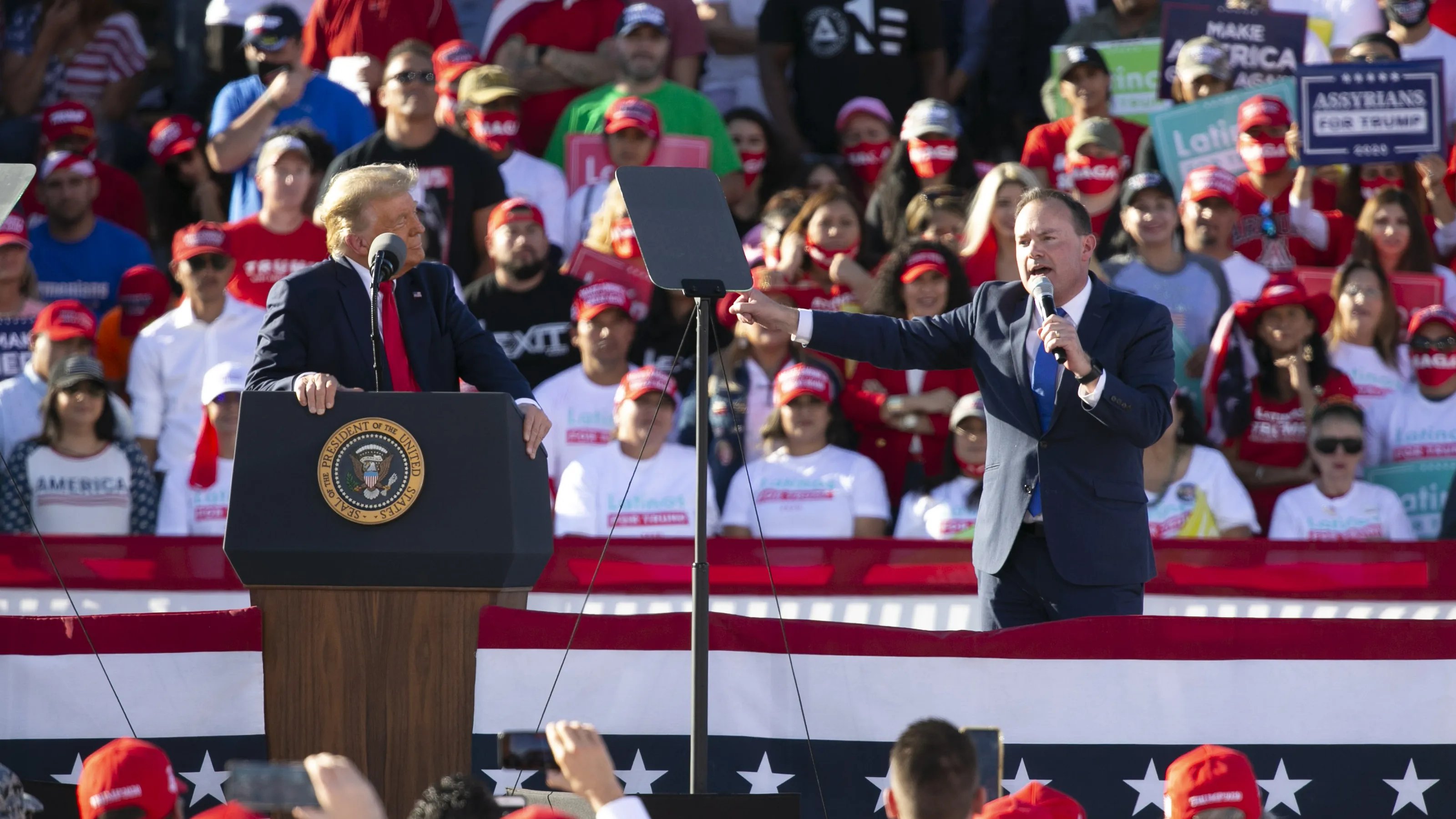 A 2020 republican GOP rally, Donald Trump at podium on left, while Mile Lee makes a speech in which he compares Trump to Captain Moroni from the book of Mormon.