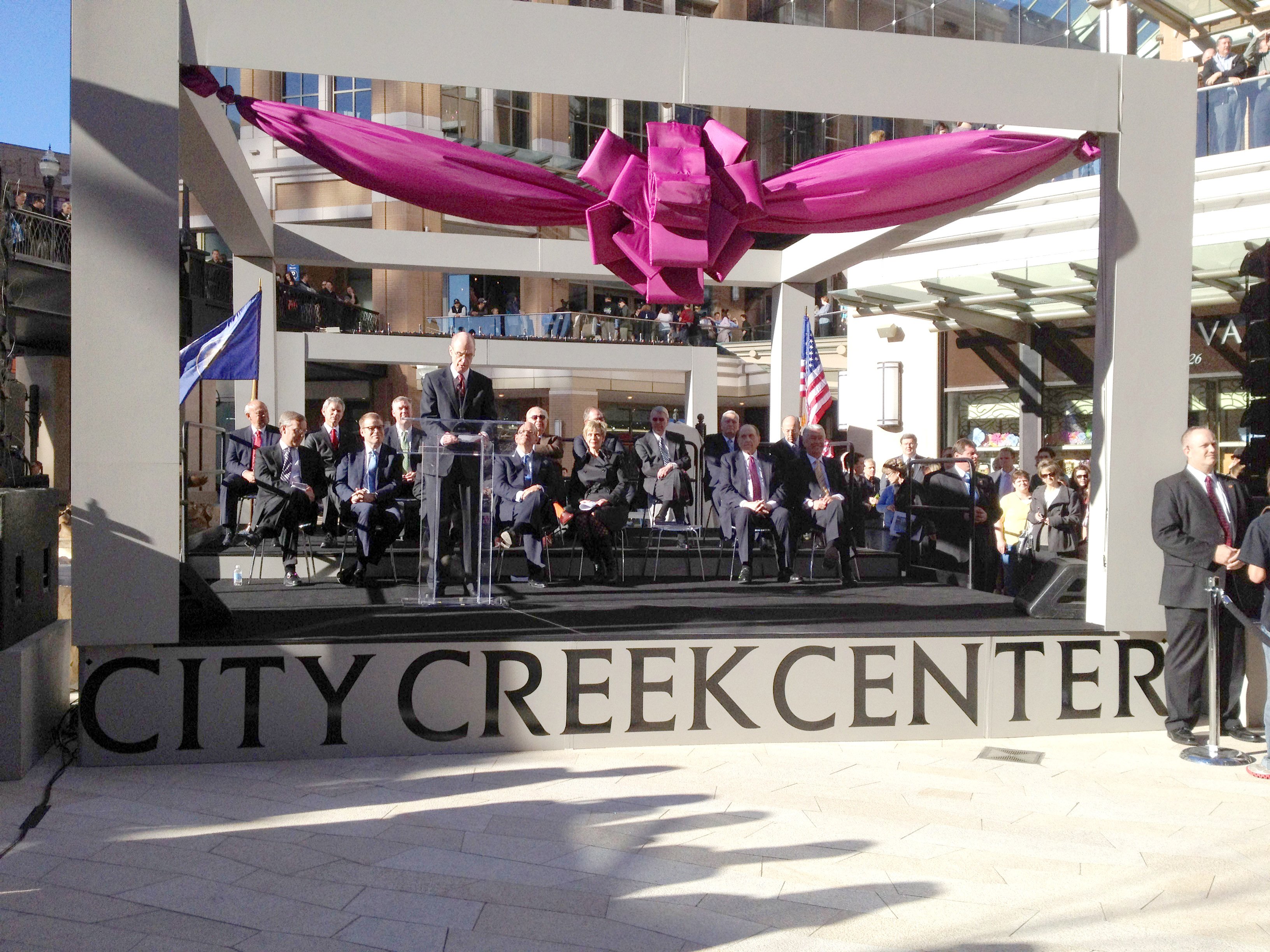 President Henry B. Eyring speaking at the grand opening of the City Creek Mall in Salt Lake City on March 22, 2012, with President Thomas S. Monson and President Dieter F. Uchtdorf sitting in attendance.