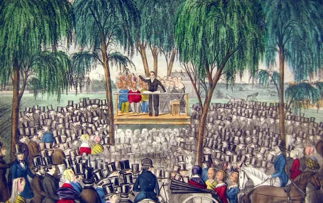 Artist’s depiction of Joseph Smith preaching at General Conference in Nauvoo, April 1844. The Prophet stands on a wooden platform beneath willow trees, addressing a large crowd of Saints wearing 1840s dress and top hats, with horses and carriages gathered in the foreground.
